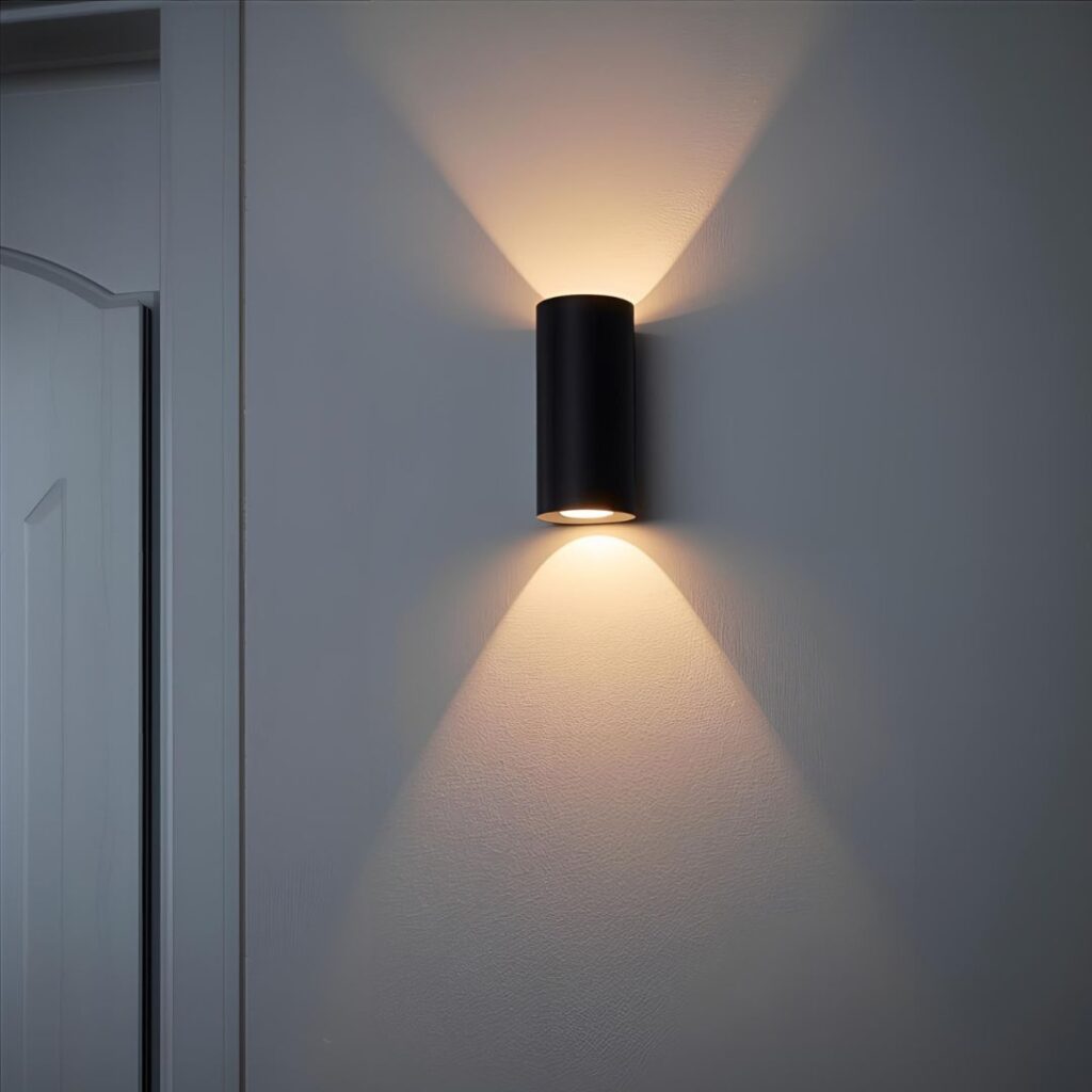 A light grey or white wall, creating a dramatic up and down light effect.